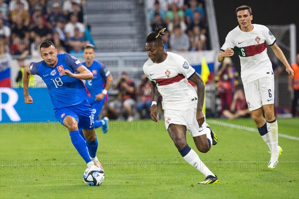 Rafael LEAO Portugal in a duel with Ivan SCHRANZ Slovakia left