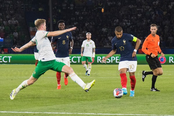 Nathan COLLINS Ireland left tries to stop Kylian MBAPPE France