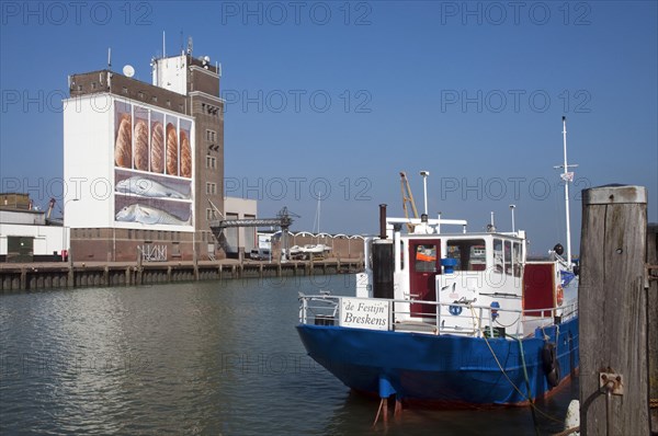 View over dock and granary with wall painting Vis en Brood