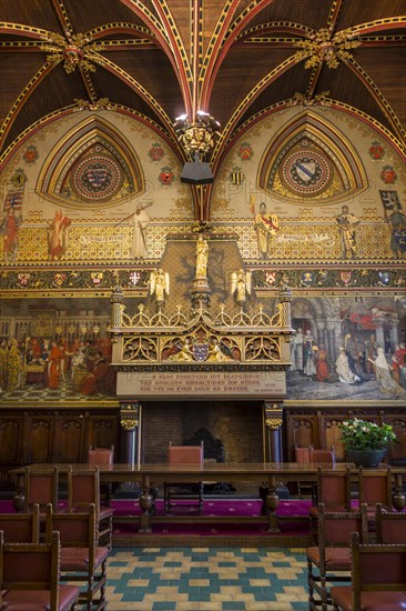 Interior of Bruges' city hall showing the Gothic hall with monumental mantelpiece