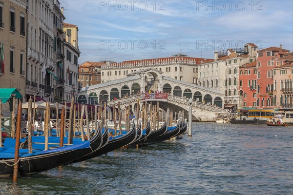 Grand Canal with Rialto Bridge and Pier with Gondolas