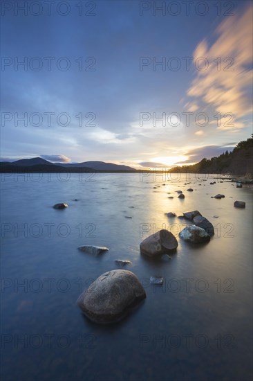 Loch Morlich and Cairngorm Mountains at sunset