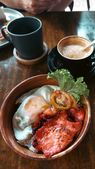 Bowl of tocilog paired with coffee