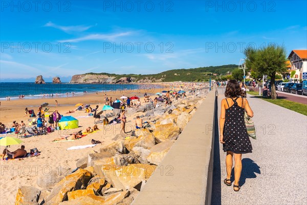 Hendaye beach one summer afternoon full of people enjoying the water in summer