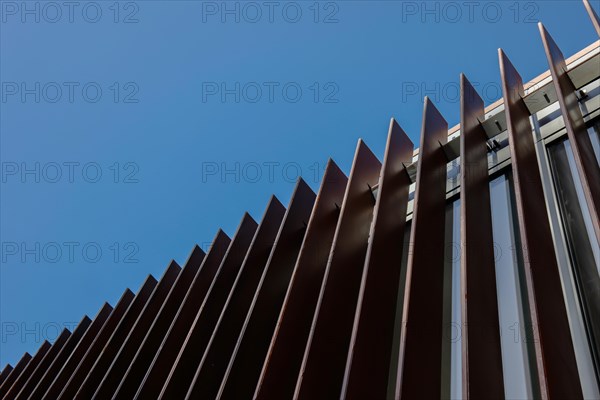 Modern Metal Grate Against Blue Clear Sky and Sunlight in Lugano