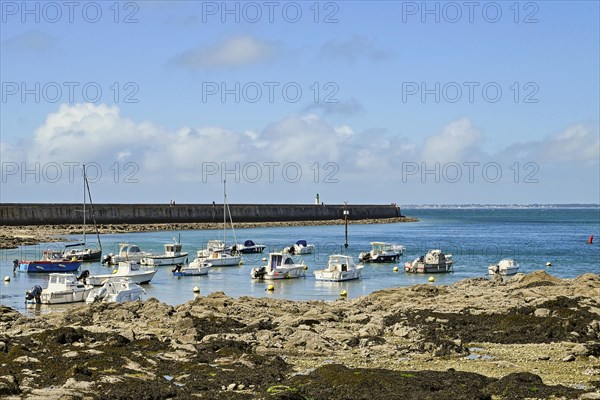 Motorboats in rocky bay