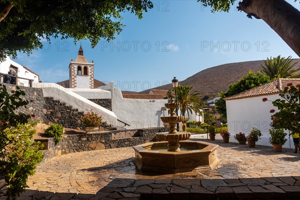 Water fountain next to the white church of Betancuria