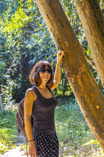 A young woman walking on a trail in Copan Ruinas. Honduras