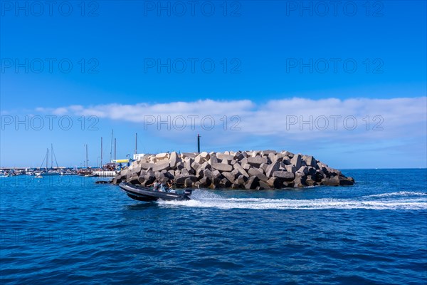 A boat arriving at the marina on the Costa de Adeje in the south of Tenerife