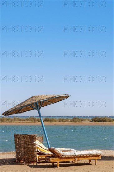 Parasol and sun loungers