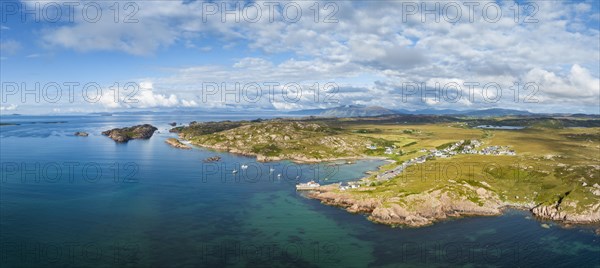 Aerial panorama of the coastline of the Ross of Mull peninsula with the fishing village of Fionnphort