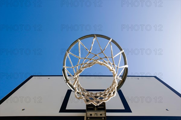 Basketball Hoop Against Blue Clear Sky with Sunlight in Switzerland