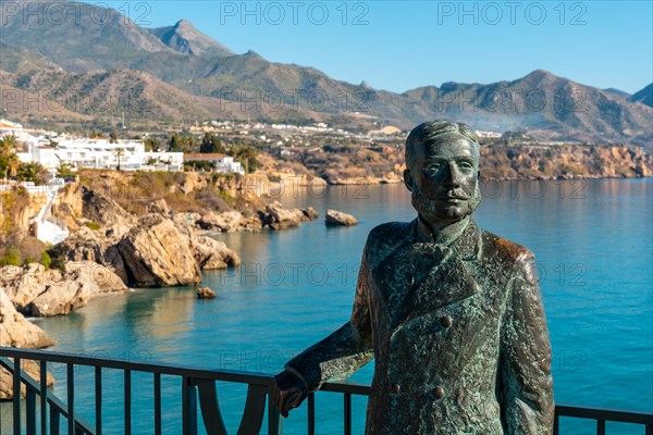 Sculpture on the Balcon de Europa and Calahonda beach in the background of the town of Nerja
