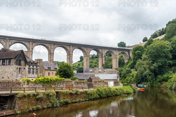 Houses and boats on the Rance river in Dinan medieval village in French Brittany