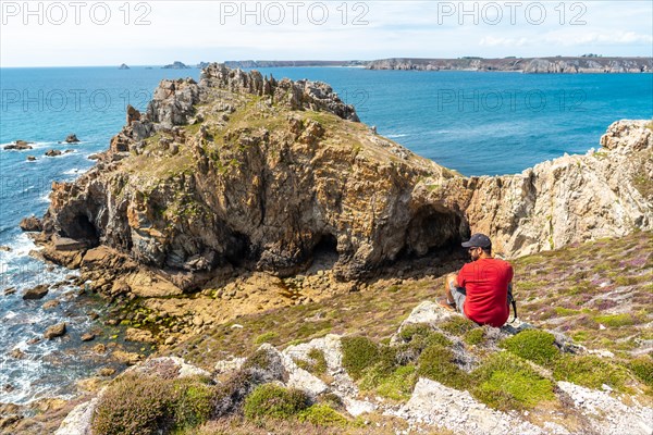 A young man enjoying the summer at Le Chateau de Dinan on the Crozon Peninsula in French Brittany