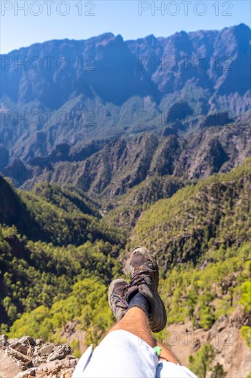 Feet of a young man resting after trekking on top of La Cumbrecita in the high mountains of La Palma island