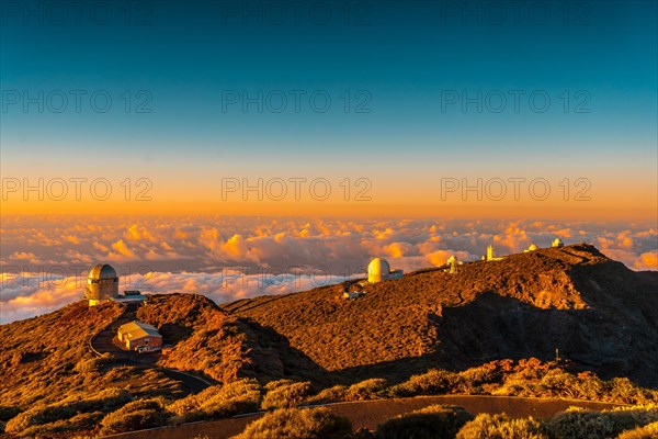 Observatories of Roque de los Muchachos in the Caldera de Taburiente in a beautiful orange sunset