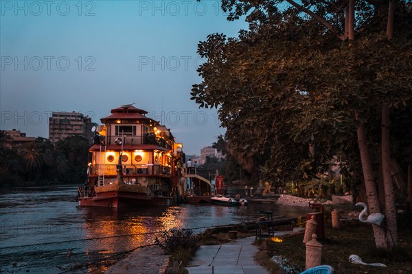 One cruise on the Nile river in the city of Cairo during the blue hour of sunset. Africa