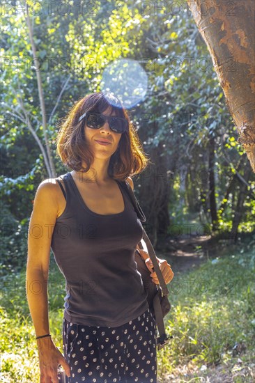 A young woman walking on a trail in Copan Ruinas. Honduras