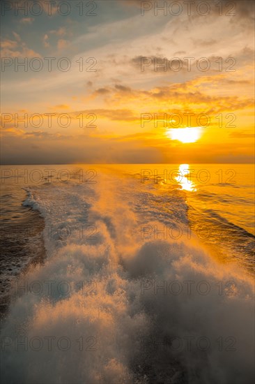 The Ceiba ferry heading to Roatan Island at sunset. Honduras