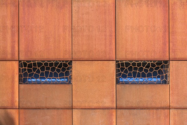 Window in a metal facade of a restaurant