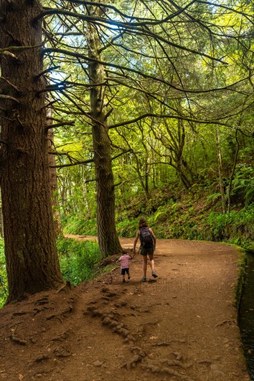 A mother with her son on the footpath at Levada do Caldeirao Verde