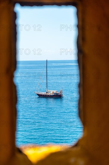 Looking out from the yellow watchtower at the Forte de Sao Tiago fort in Funchal by the sea. Madeira