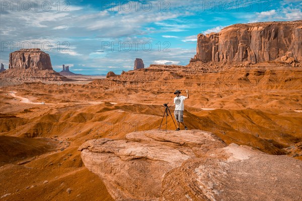 A European photographer at John Ford's Point in Monument Valley. Utah