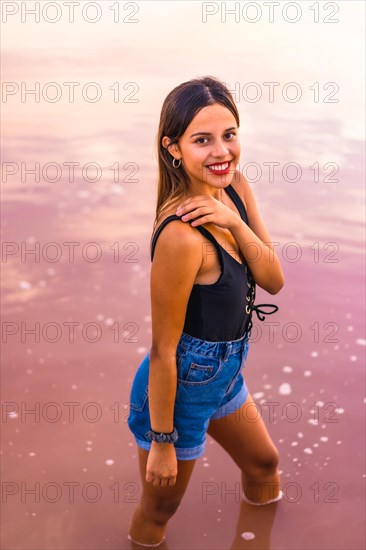 Lifestyle of a young brunette Caucasian on vacation in the pink lagoon of Torrevieja in summer
