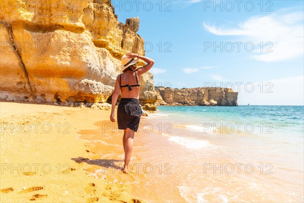 A woman on beach vacation at Praia da Coelha