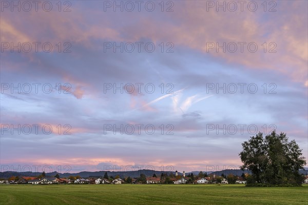 The town of Isny im Allgaeu at sunset with some coloured clouds in the sky. Isny im Allgaeu