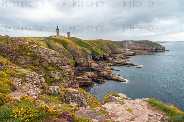 The beautiful coastline next to the Phare Du Cap Frehel is a maritime lighthouse in Cotes-dÂ´Armor France . At the tip of Cap Frehel