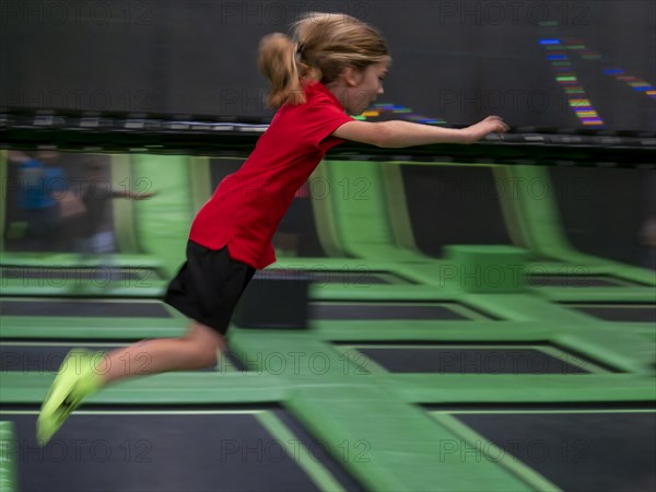 Young boy jumping and playing