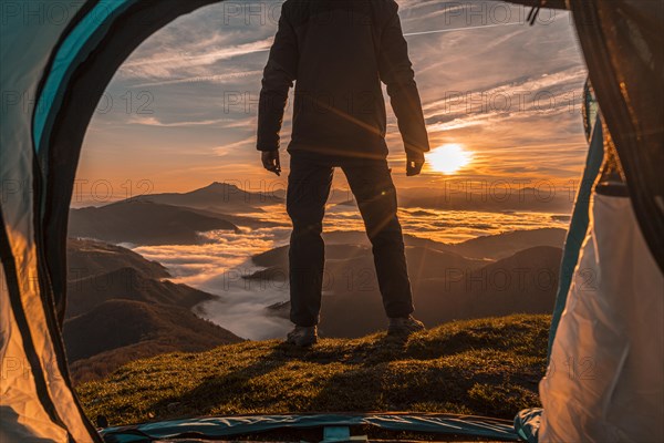 Orange sunrise from inside the tent. Basque Country