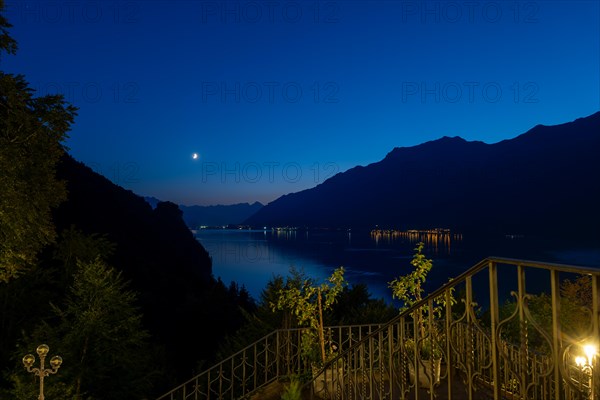 View over Lake Brienz with Mountain and Moon in Dusk in Giessbach in Brienz
