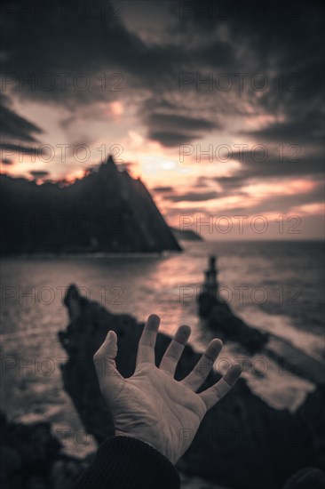 A hand of a young man in the lighthouse of the municipality of Pasajes San Juan in Gipuzkoa. Basque Country