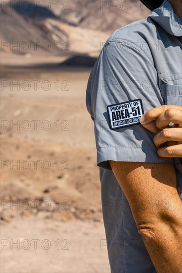 A young man with a patch for Area 51 clothing on Artist's Drive in Death Valley