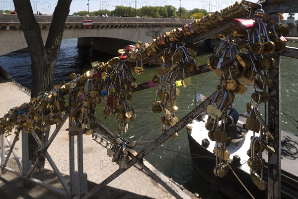 Love locks on a staircase to the Seine