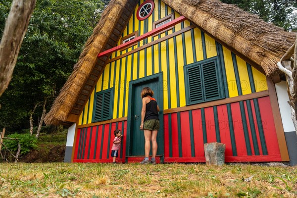 Playing in a traditional Madeiran house like those of Santana in the forest of Caldeirao Verde