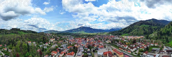 Aerial view of Immenstadt im Allgaeu with a view of the Alps. Immenstadt im Allgaeu