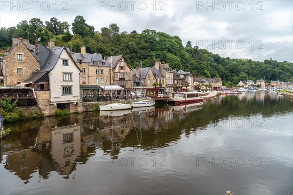 Houses and boats on the Rance river in Dinan medieval village in French Brittany