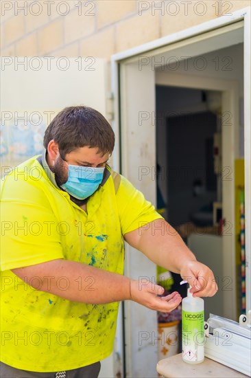 Worker in a recycling factory or clean point and garbage with a face mask and with security protections