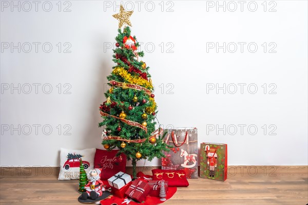 Domestic living room decorated with Christmas tree and Christmas decoration with gifts