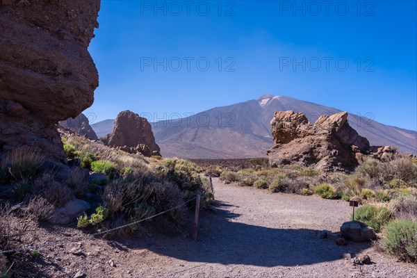 Path to walk between the Roques de Gracia and the Roque Cinchado in the natural area of Mount Teide in Tenerife