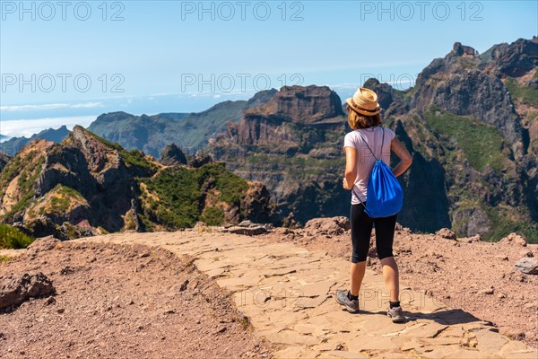 A tourist on the trekking trail at Pico do Arieiro
