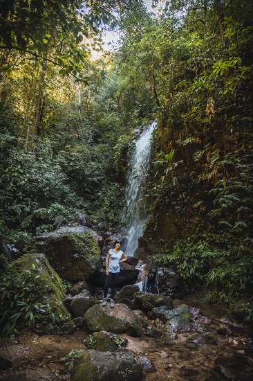 A cheerful young woman in the Cascada del Cerro Azul Meambar National Park