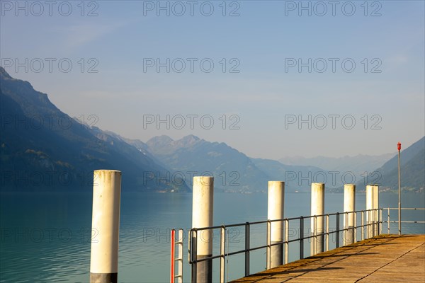 Harbor with Columns and View over Lake Brienz with Mountain and Sunlight in Brienz