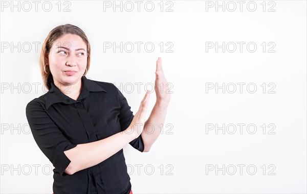 Displeased young woman rejecting with palms hands isolated. Disgusted young woman with rejection gesture. He frowns in disgust