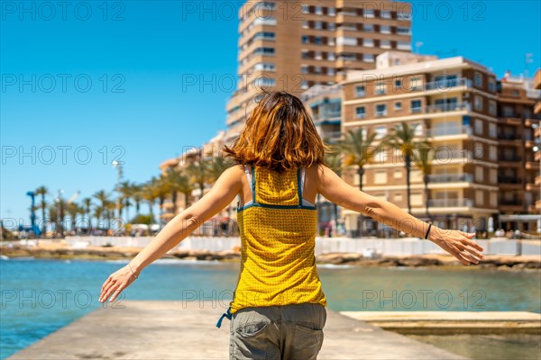 A young woman enjoying the holidays in the coastal city of Torrevieja
