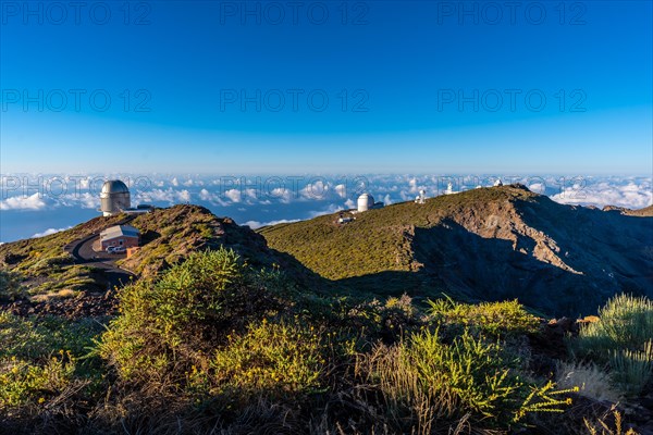 Observatories of the Roque de los Muchachos in the Caldera de Taburiente with a sea of nuts below one summer afternoon